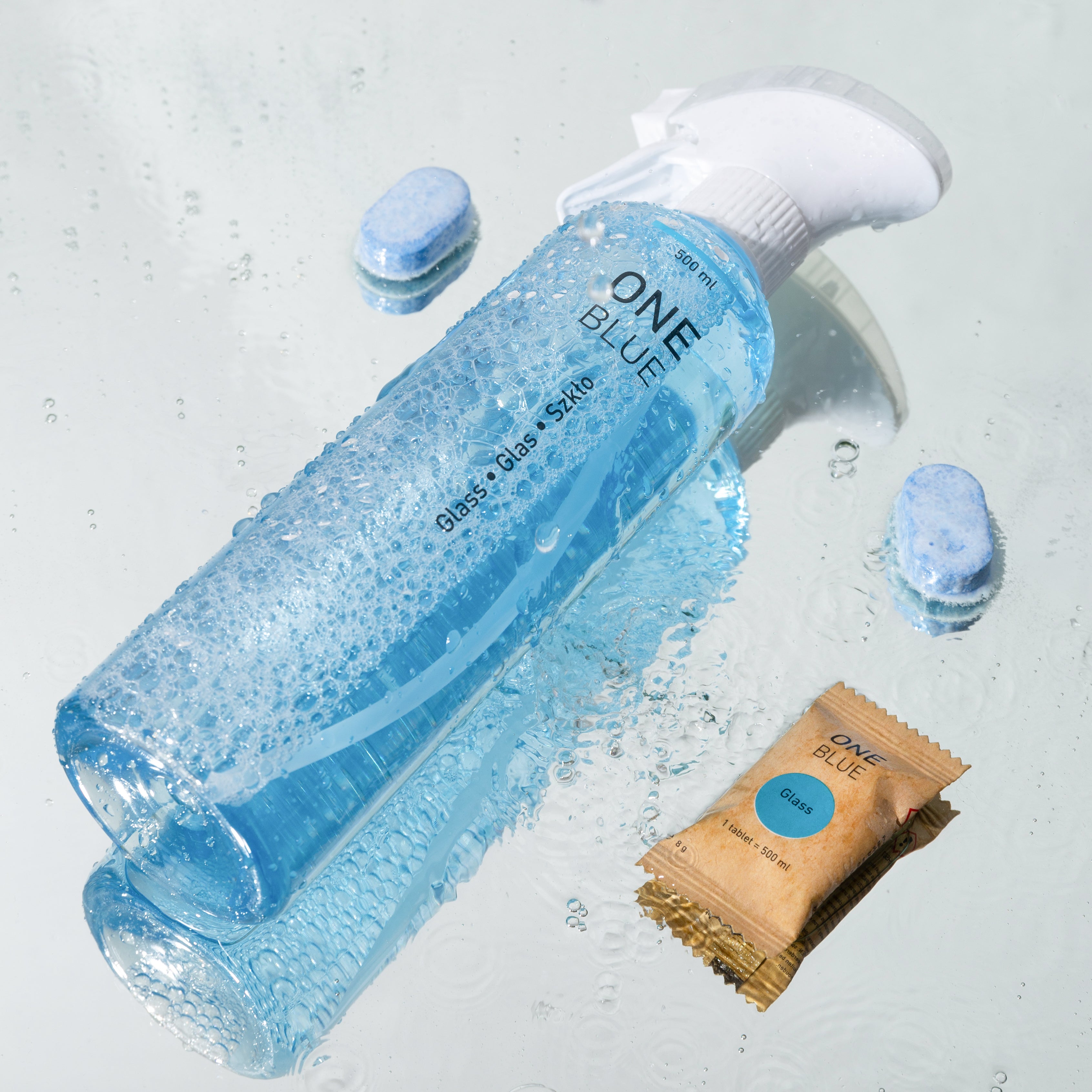 Glass cleaner bottle and tablets with a scent of ocean fresh