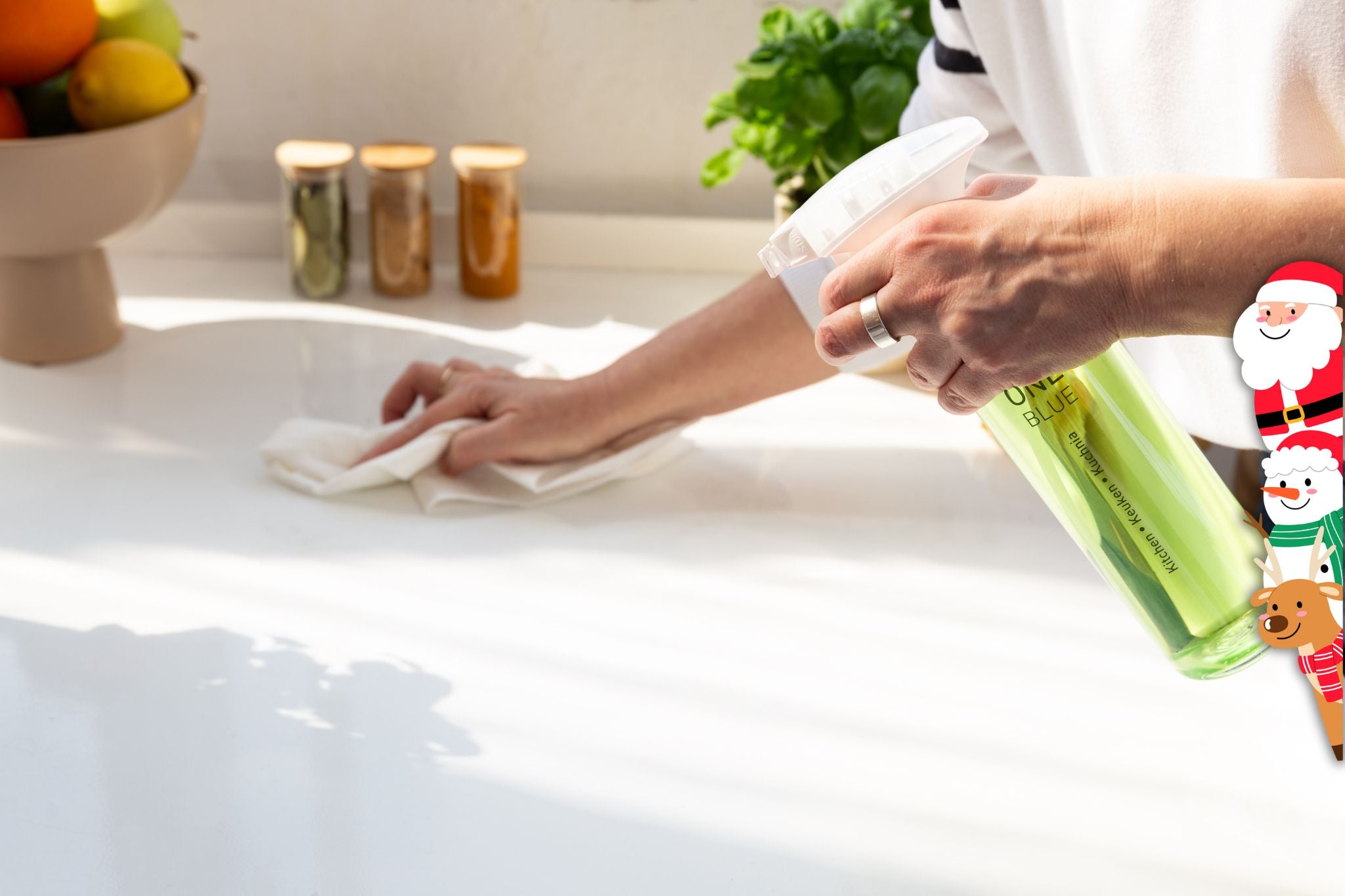 Cleaning with One Blue eco kitchen cleaner with Christmas figures